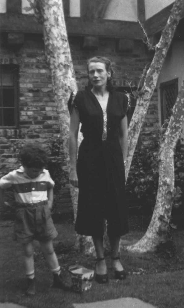 Mother wi Raymond in 1950 on front lawn of 3701 Shannon Rd.